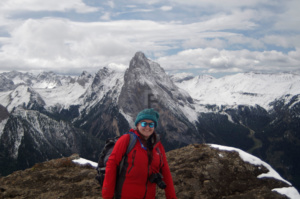 Gemma posing for a photo in front of Marmolada