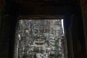 Another Lokesvara seen through a doorway on the upper level of the Bayon Temple