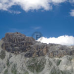 The path PAth leading around the top of a steep scree slope below steep mountain sides