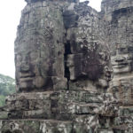 2 towers set at different heights each adorned by the Lokesvara faces 2 towers set at different heights each adorned by the Lokesvara faces
