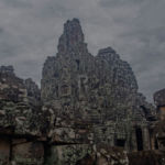 The central tower seen through the outer ruins of Bayon temple The central tower seen through the outer ruins of Bayon temple