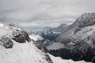 Looking up the valley to lake Fedaia Looking up the valley to Lake Fedaiai far below and Civetta in the far distance