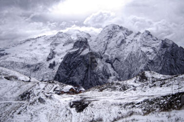 My favourite view of Marmolada Marmolada behind the risge with a rifugio in the foreground
