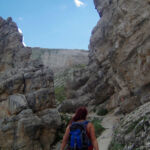 Gem amongst rocky spires Rocy spires either side of the path