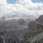 Stevia, Sell and Grand Cir Stevia on the right with steep scree slopes into Vallunga far below with Grand Cir And Sella in the Distance